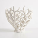 Large white decorative coralline bowl with an open-branching pattern on a stepped base.