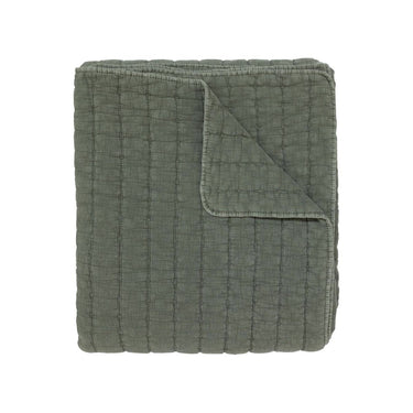 A  quilted cotton blanket in a muted sage green colour.