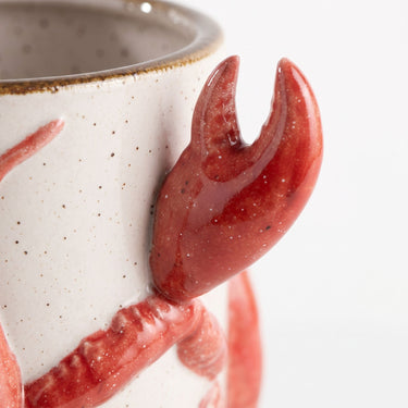 Red crayfish ceramic vase with a glossy red crayfish wrapped around a speckled cream body