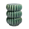 A green glazed accent table with a stacked, ribbed pumpkin-like design.