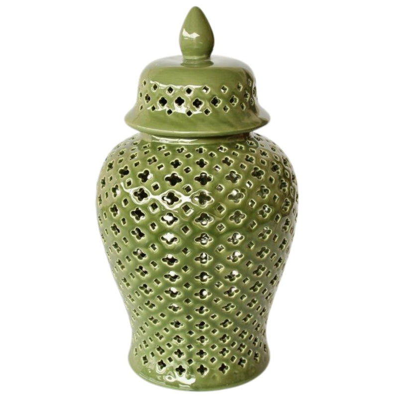 A green ginger jar with a detailed cut-out pattern and a lid.