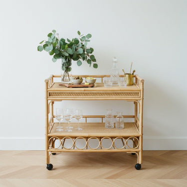 rattan drinks trolley styled with eucalyptus and decanter