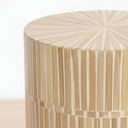 Close-up of the round tabletop surface showing a natural mother of pearl mosaic inlay pattern.