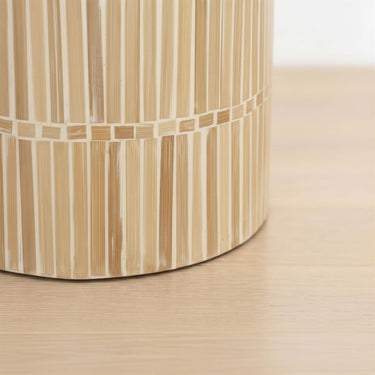 Base of a side table in a rounded form and a natural mother of pearl finish.