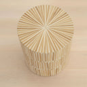 rounded form and a natural mother of pearl finish of the dune side table