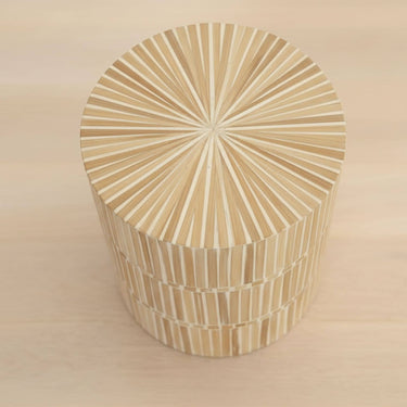 rounded form and a natural mother of pearl finish of the dune side table