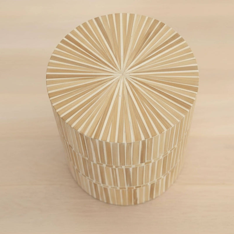 rounded form and a natural mother of pearl finish of the dune side table