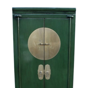 authentic solid brass central panel on a green Dynasty cabinet.