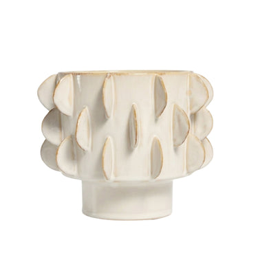 Eclipse pedestal ceramic pot in glossy ivory off-white with raised tactile pattern.