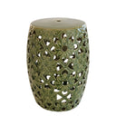 High-gloss emerald green ceramic stool with pierced floral medallion lattice design and flat circular top.