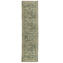 Long rectangular green and beige patterned rug 