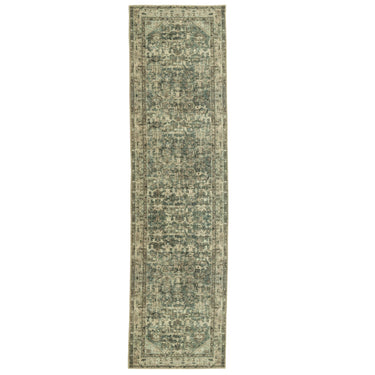 Long rectangular green and beige patterned rug 