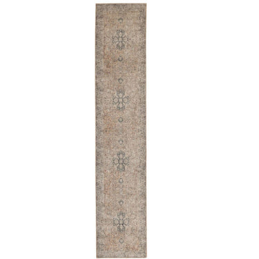 Long runner rug with a distressed traditional pattern in beige, taupe, and muted blue-grey tones in durable polyester.