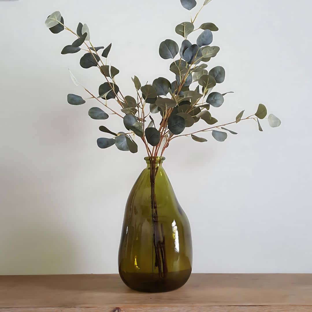 eucalyptus stems in glass vase