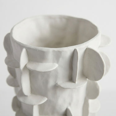 Flange ceramic tall white vase  top with grid pattern side.