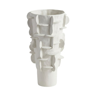 A white ceramic sculptural vase with an organic, layered abstract design and a flared base.
