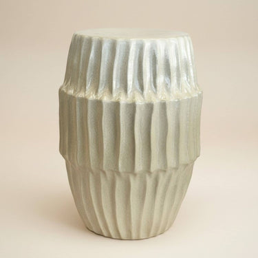 fluted ceramic side table in iridescent pearl glaze