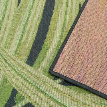 Close-up of the Folia Black Rug detailed tropical botanical pattern