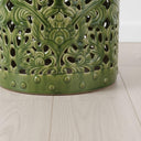 Detail shot of the stud trim along the base of the Forest Ceramic Stool, showing the decorative relief beading against the high-gloss dark green finish