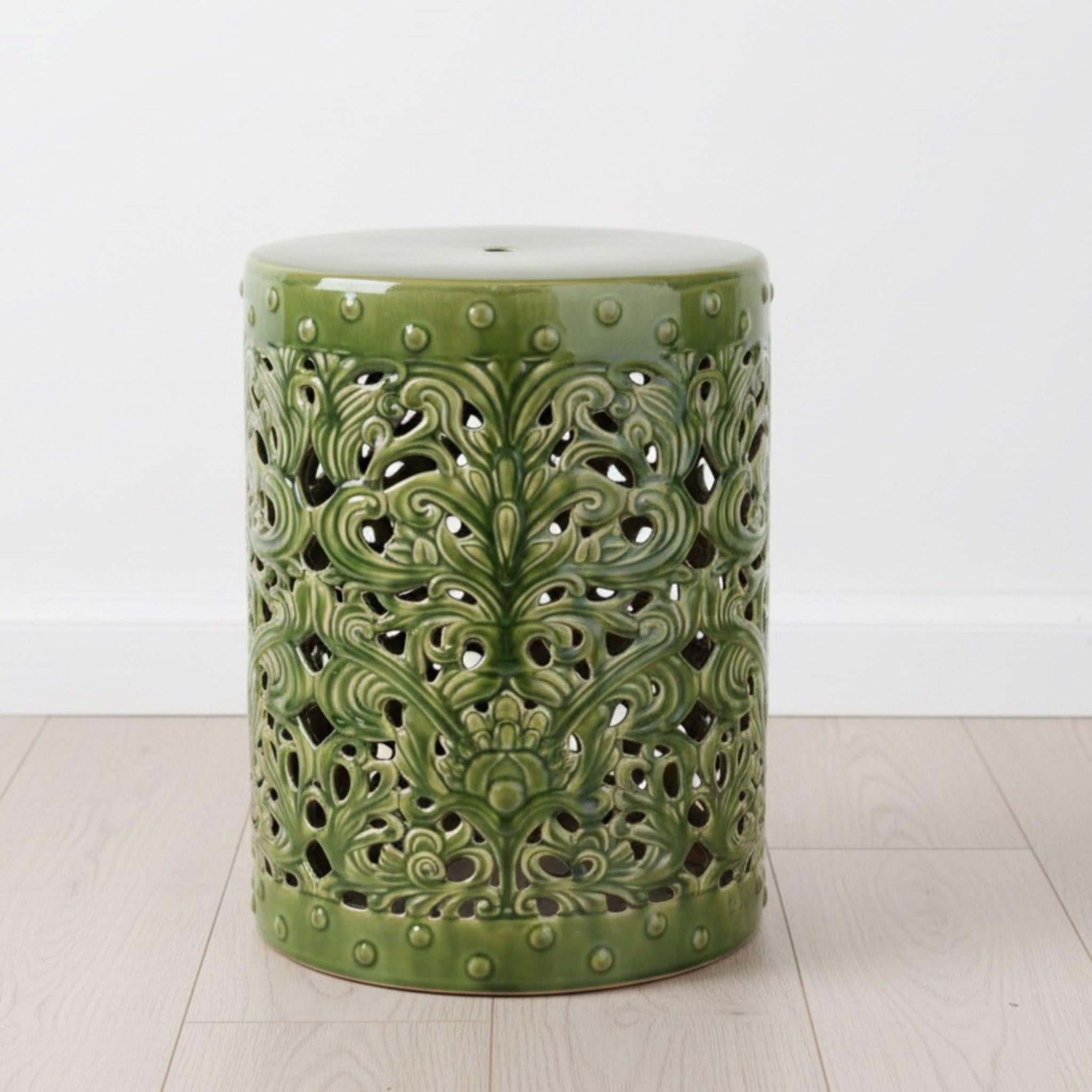 Forest Ceramic Stool styled alone in a minimal white room, used as a side table 