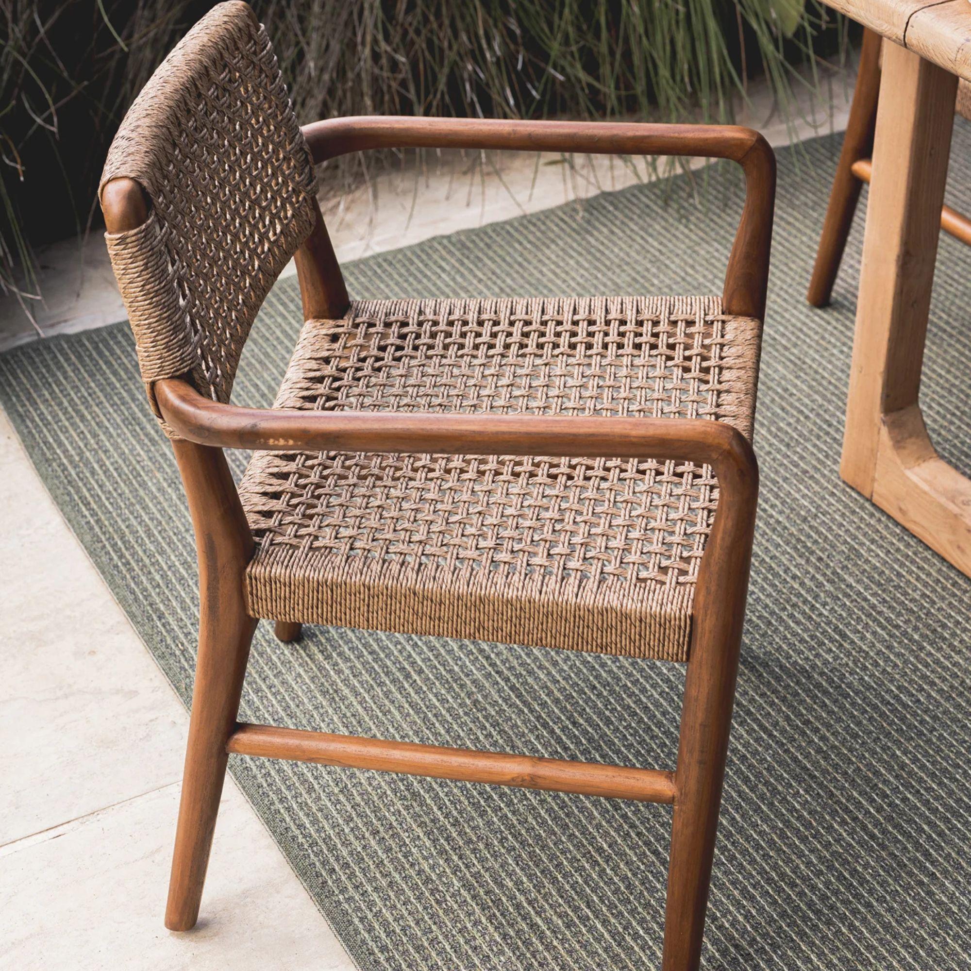 Goa Teak dining arm chair styled on outdoor patio with plush UV-resistant rope seat and back, perfect for modern outdoor entertaining