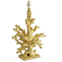 Faux coral table lamp base in a metallic gold finish with a square clear pedestal.