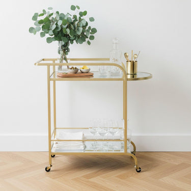 gold drinks trolley styled with eucalyptus and decanter