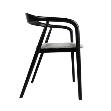 A modern dining chair with a linen-look cushioned seat and elegant wood frame