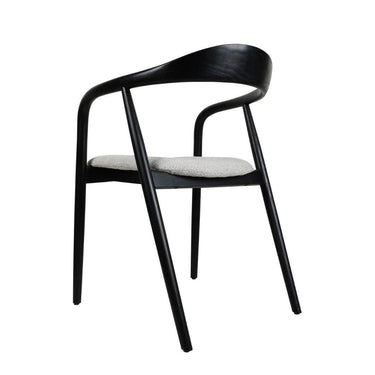 An elegant black coloured dining chair with a curved backrest and cushioned seat.