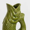 Detailed close-up of green ceramic koi jug vase