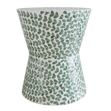 Green shell accent stool with hourglass shape and leaf pattern