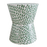 Green shell accent stool with hourglass shape and leaf pattern