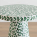 Close-up of green shell inlay on side table edge