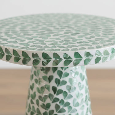 Close-up of green shell inlay on side table edge