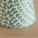 Green shell leaf detail on pedestal side table base