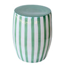 Angled view of the Green striped side table highlighting the solid green circular top and smooth rounded ceramic silhouette.