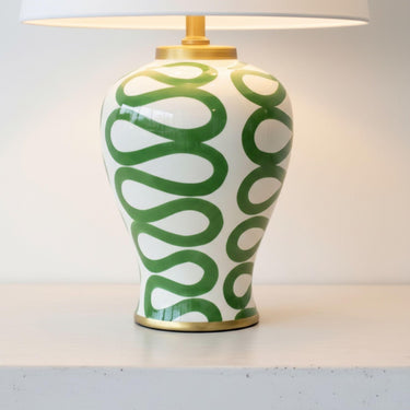Detailed view of the unique hand-painted green swirl design and gold-painted trim on the Green Swirl Lamp.