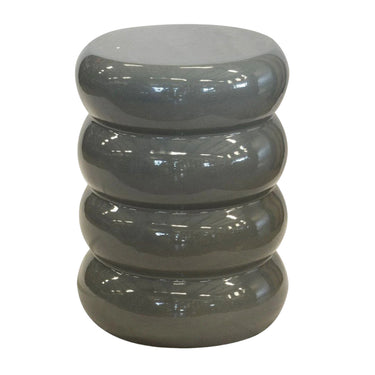 Gray cylindrical ceramic table with stacked design on a white background