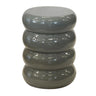 Gray cylindrical side table with stacked ring design on a white background