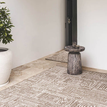 Gridlock large geometric outdoor patio rug in the brown Suntan colour in outdoor garden.