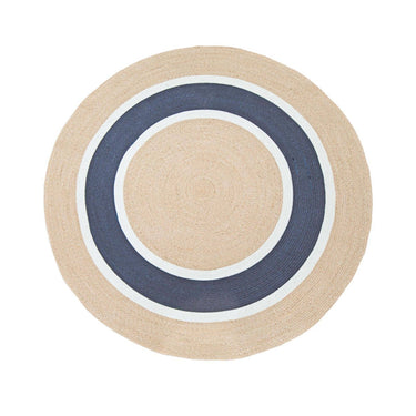 A round rug with concentric circular stripes in natural beige, navy blue, and white.