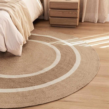 Large 220cm round rug styled in a modern   bedroom