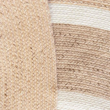 Hand-braided neutral round outdoor rug in simple modern design