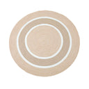 A round rug with concentric circular stripes in natural, beige  and white.