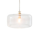 A modern pendant light with a clear glass drum shade and a brass metal fixture, suspended by a thin cord.