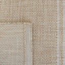 Jive indoor outdoor runner rug in beige with white border close-up of a textured carpet