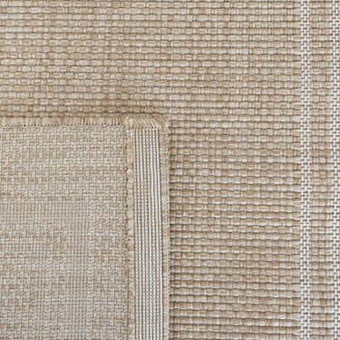 Jive indoor outdoor runner rug in beige with white border close-up of a textured carpet
