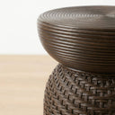 Brown outdoor side table ribbed circular top.