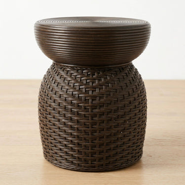 Brown woven rattan side table with a Round top.
