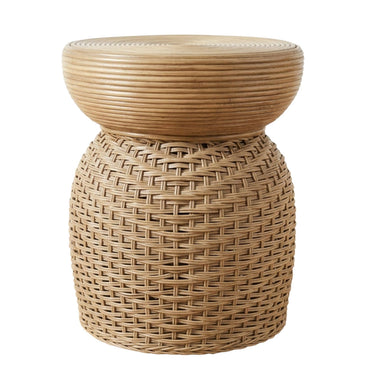 A natural woven rattan side table with a round slatted top and a textured cylindrical base.